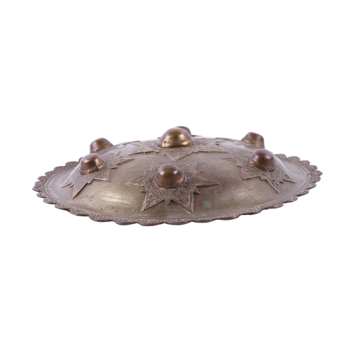 91 - A Sumatran Acehnese Peurise Teumaga brass shield, 26cms diameter.