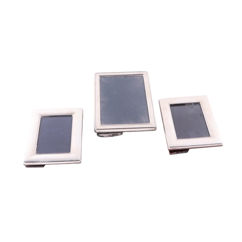 Three modern silver rectangular strut photo frames, the largest 14 by ...