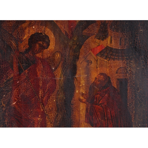An Eastern European icon depicting a saint and a bearded figure ...
