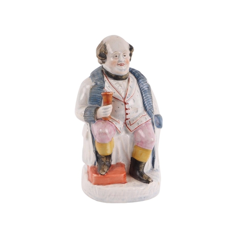 A 19th century Pearlware figure depicting a portly gentleman seated ...