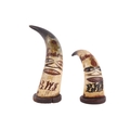 Two 19th century Jamaican carved and polychromed cow horn effigies ...