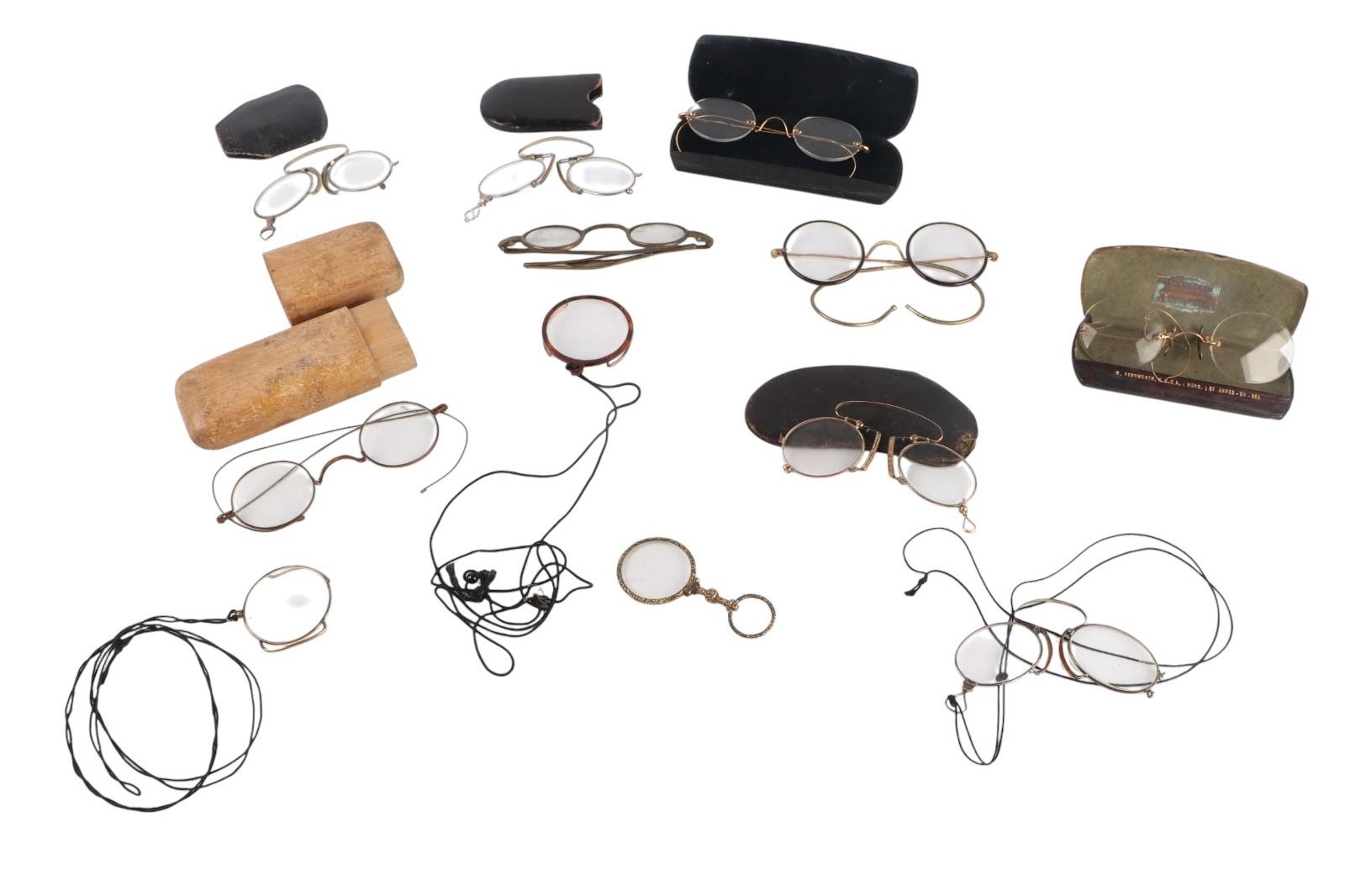 A collection of antique optical items to include spectacles, monocles ...