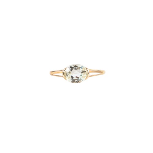 A 9ct gold solitaire dress ring, set with a single oval pale yellow ...
