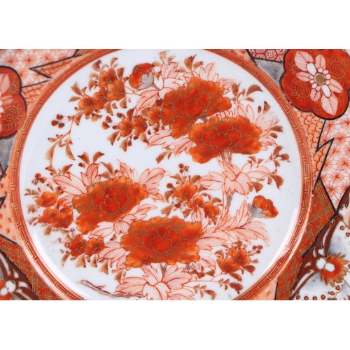 724 - A pair of large Japanese Meiji period Kutani plates decorated with goldfish on a black ground, 30cms... 