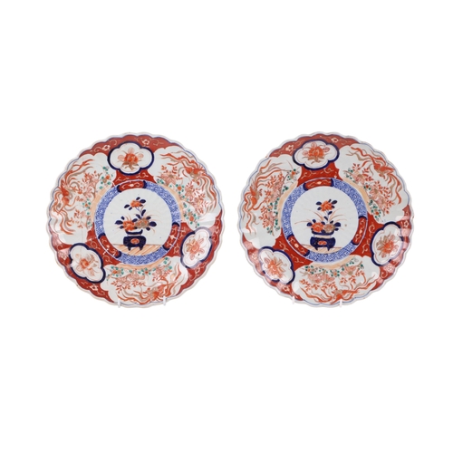 741 - Two Japanese Imari plates, each 31cms diameter (one a/f).