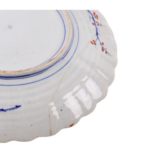 741 - Two Japanese Imari plates, each 31cms diameter (one a/f).