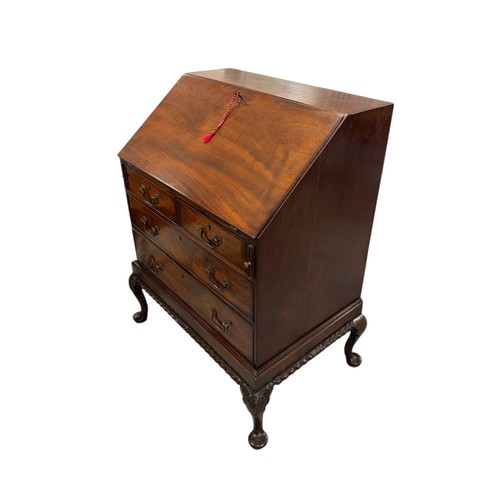 776 - A George III style mahogany bureau, the fall-front opening to reveal a fitted interior with pigeon h... 