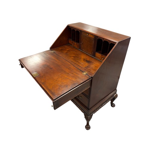 776 - A George III style mahogany bureau, the fall-front opening to reveal a fitted interior with pigeon h... 