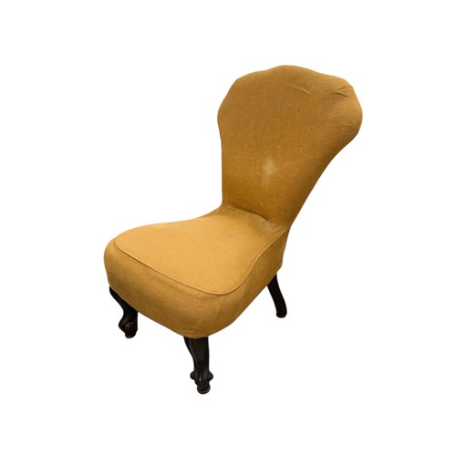 786 - A Victorian upholstered nursing chair with spoon back and seat and carved mahogany dwarf cabriole fr... 