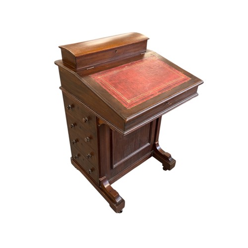 796 - An Edwardian mahogany Davenport with four real and four faux drawers, 54cms wide.