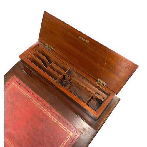 796 - An Edwardian mahogany Davenport with four real and four faux drawers, 54cms wide.