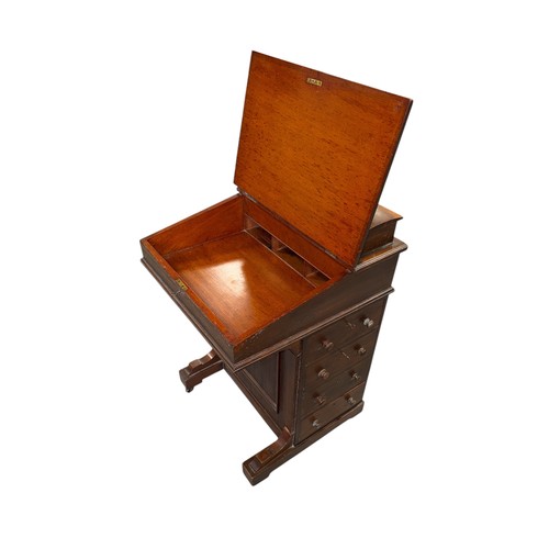 796 - An Edwardian mahogany Davenport with four real and four faux drawers, 54cms wide.