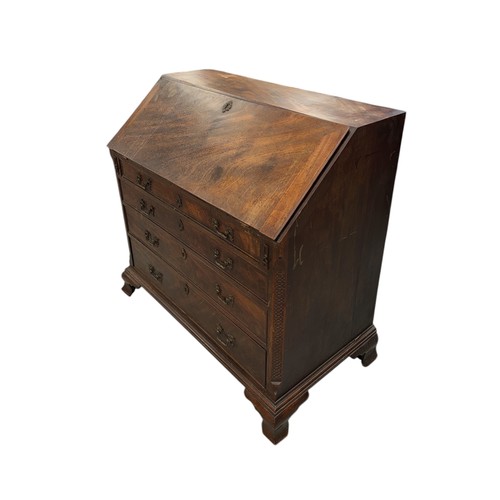 837 - An early 19th century mahogany bureau, the fall-flap enclosing a fitted interior above four graduate... 
