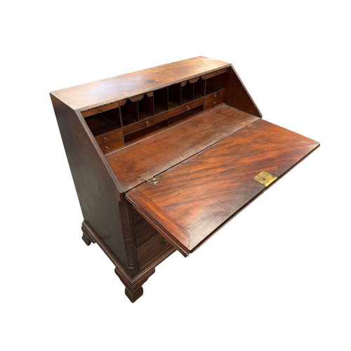 837 - An early 19th century mahogany bureau, the fall-flap enclosing a fitted interior above four graduate... 