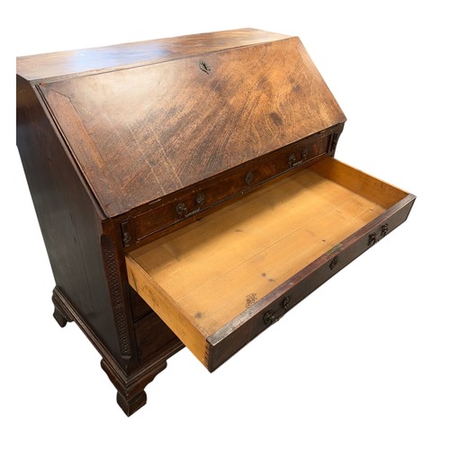 837 - An early 19th century mahogany bureau, the fall-flap enclosing a fitted interior above four graduate... 