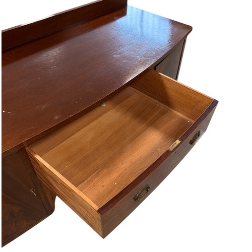 849 - A George III style mahogany bowfronted sideboard with central frieze drawer flanked by cupboards, 16... 