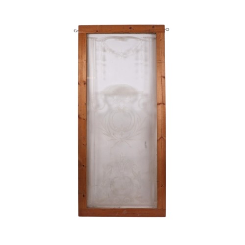 854 - An etched glass pub type window, frame, 63 by 157cms; together with an arched etched and half mirror... 
