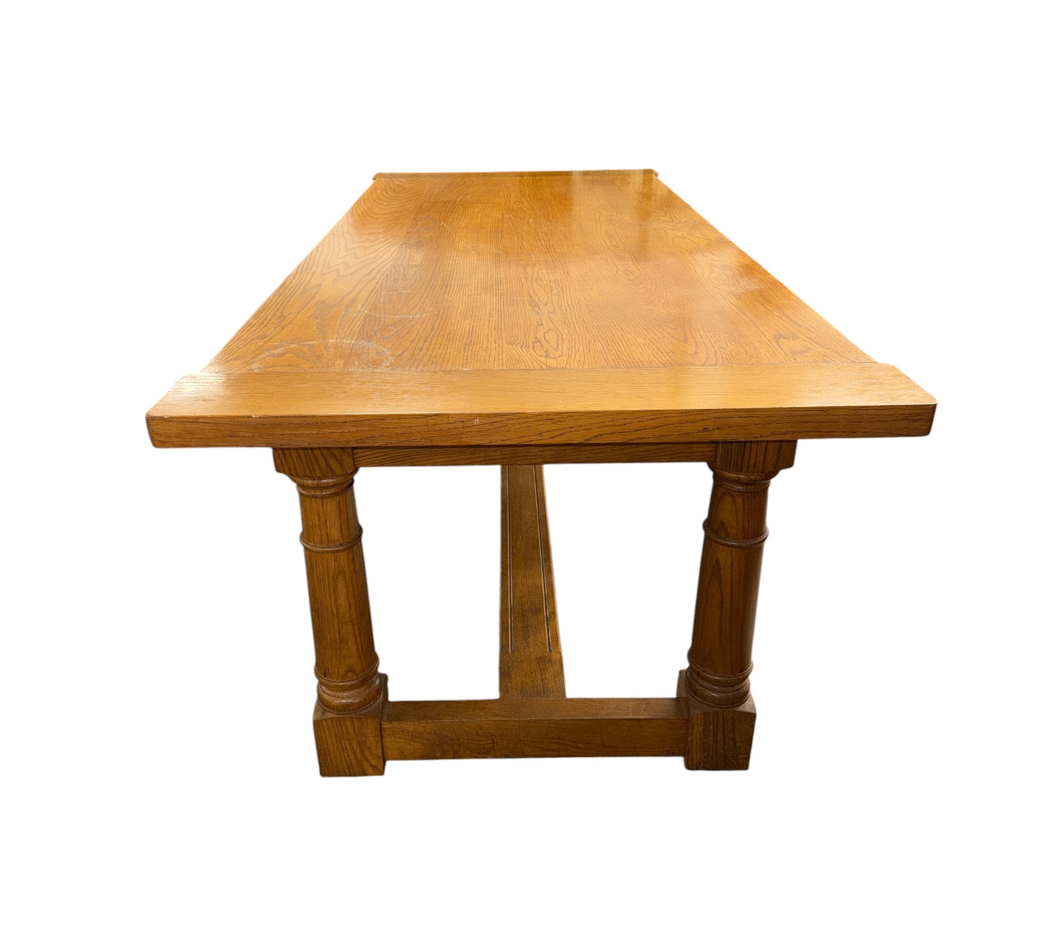 An oak refectory table with a detachable cleated end top above a ...