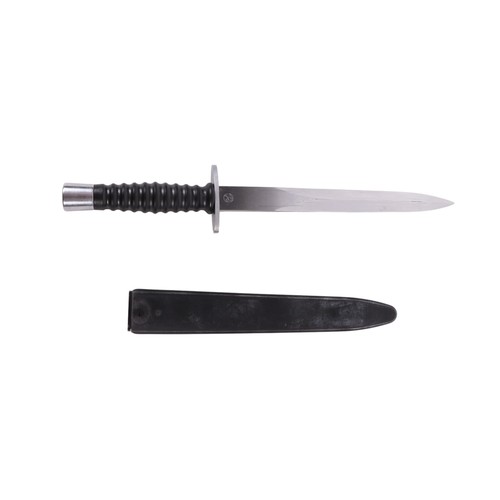 139 - A Swiss SIG model 1957 fighting knife in its composition scabbard. Serial No. W 612304 on ricasso. M... 