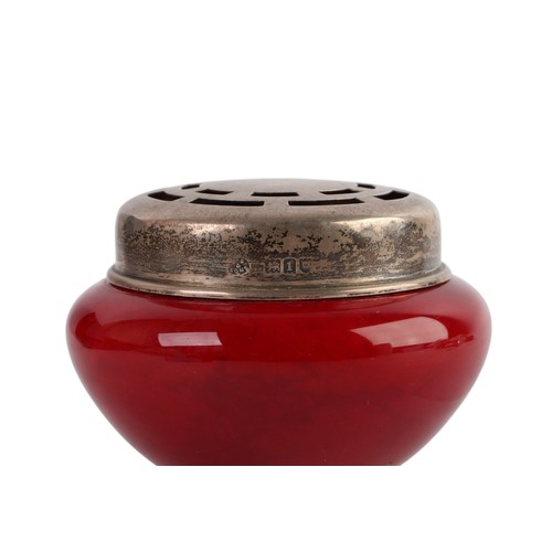 334 - A Edwardian Royal Doulton flambe potpourri pot, with silver cover, London 1906, 8cm diameter.