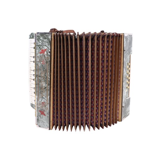 379 - A Puratone piano accordian, cased.