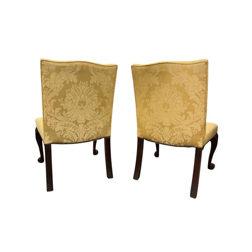 1024 - A pair of 19th century occasional chairs, with upholstered seats and backs, on acanthus leaf capped ... 