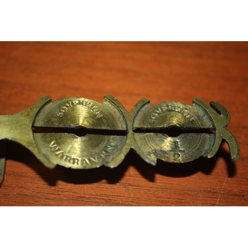 13 - A Pair of Vintage Brass Sovereign Hand Scales