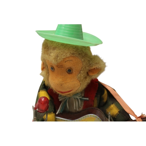 23 - Vintage 1950's Battery Operated Rock 'n' Roll Monkey, in Original Box. 30cm Tall