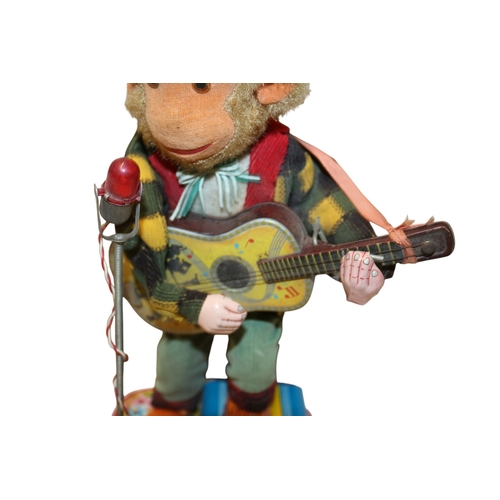 23 - Vintage 1950's Battery Operated Rock 'n' Roll Monkey, in Original Box. 30cm Tall