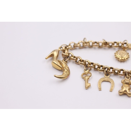 136 - 9ct gold charm bracelet with 15 charms 8.3 grams gross