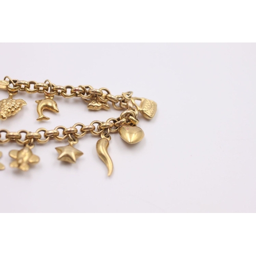 136 - 9ct gold charm bracelet with 15 charms 8.3 grams gross