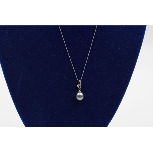 137 - 18ct white gold pearl & diamond pendant on 14ct gold necklace 2.5 grams gross