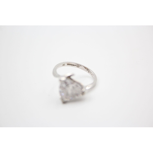 197 - 9ct white gold gemstone bypass design ring 4.4 grams gross