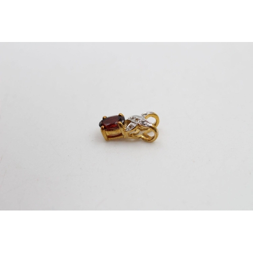 201 - 9ct Gold garnet & diamond detail pendant 2.2 grams gross