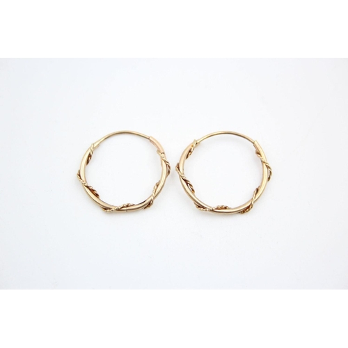 210 - 2 x 9ct gold rope wound hoop earrings 1.6 grams gross