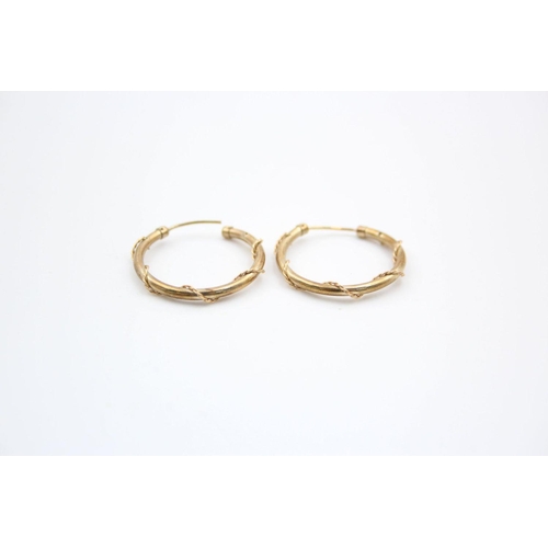 210 - 2 x 9ct gold rope wound hoop earrings 1.6 grams gross