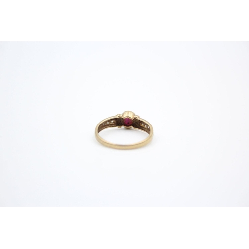 216 - 9ct Gold ruby & diamond detail dress ring 2 grams gross