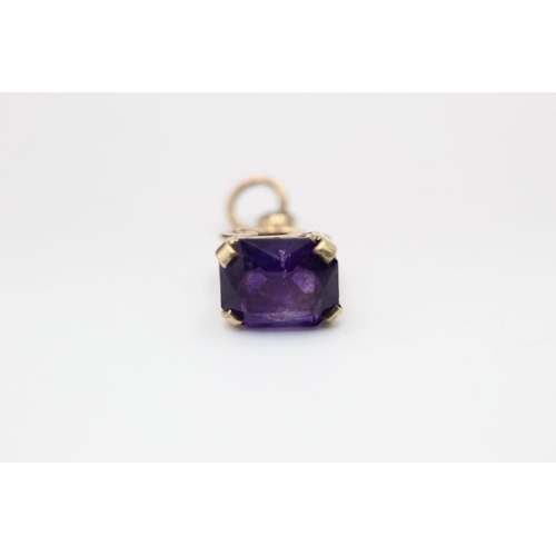 224 - 9ct Gold amethyst ornate fob pendant 2.1 grams gross