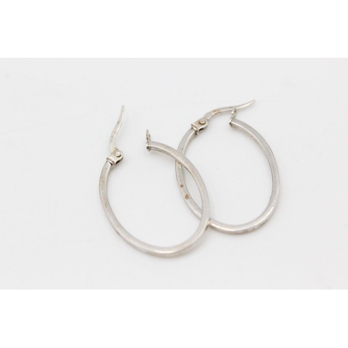 239 - 2 x 9ct white gold hoop earrings 2.5 grams gross