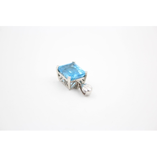 254 - 9ct White gold blue topaz pendant 5.6 grams gross