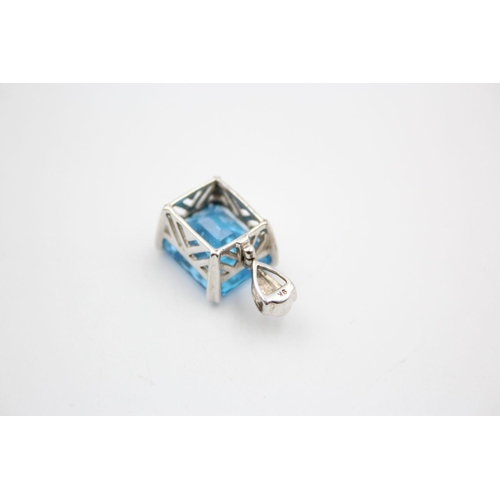 254 - 9ct White gold blue topaz pendant 5.6 grams gross