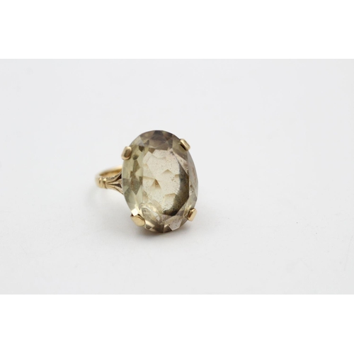 259 - 9ct gold Antique citrine dress ring with carved gallery and shoulders 7.5 grams gross