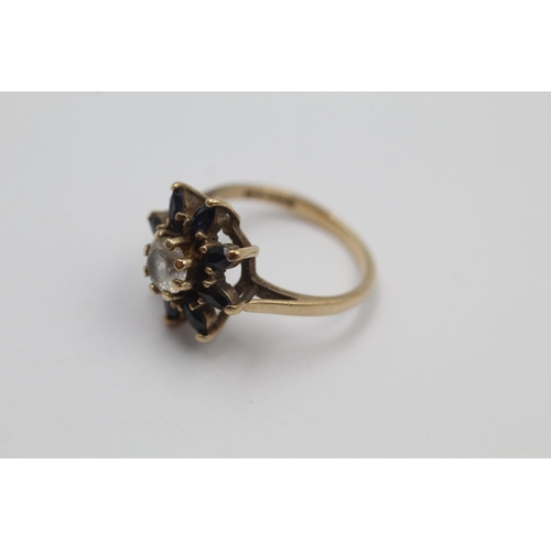 270 - 9ct gold stone set floral cluster ring 2.6 grams gross