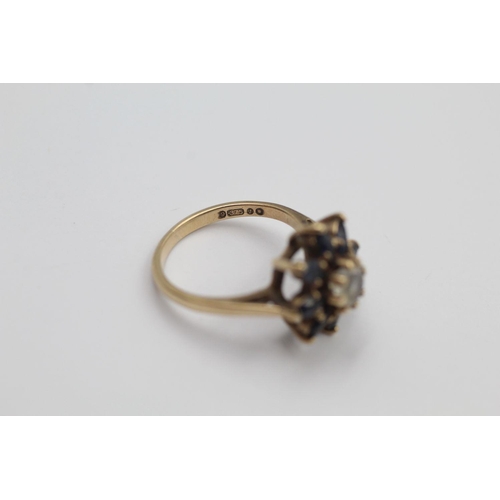 270 - 9ct gold stone set floral cluster ring 2.6 grams gross