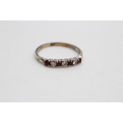 276 - 9ct Gold ruby & diamond seven stone ring 1.5 grams gross