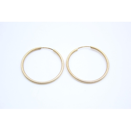 28 - 2 x 9ct gold hoop earrings 3.5 grams gross