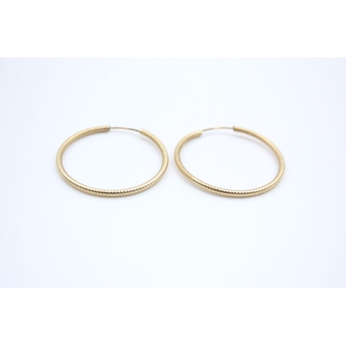 28 - 2 x 9ct gold hoop earrings 3.5 grams gross