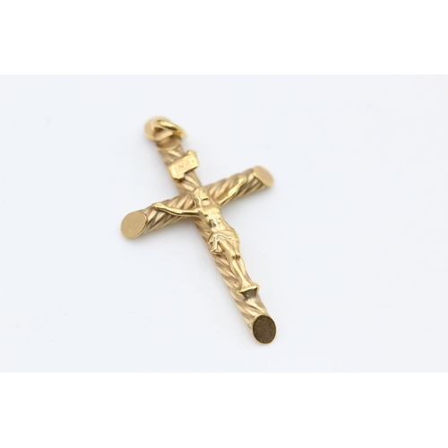 287 - 2 x 9ct gold crucifix pendants 3.7 grams gross