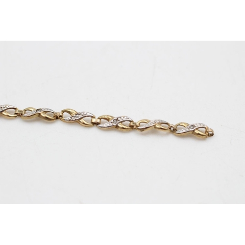 289 - 9ct gold diamond figure of eight bracelet 2.1 grams gross