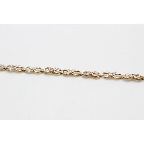 289 - 9ct gold diamond figure of eight bracelet 2.1 grams gross